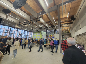 Attendees of the Wild Mushroom Show wander the PUB, observing the mushroom-themed delights on display.